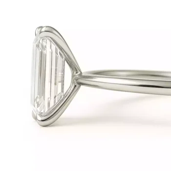 Side profile of emerald cut solitaire lab-grown diamond ring in white gold setting