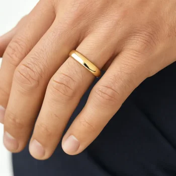 14K gold men's wedding band ring worn on hand showcasing its elegant shine