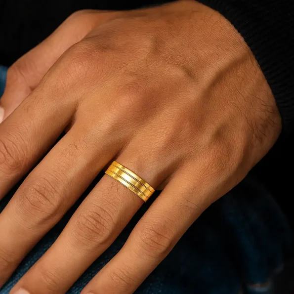 Men’s 14K gold band worn on finger with casual outfit – double groove matte polish design