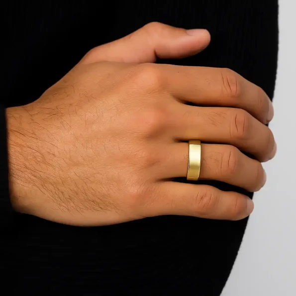 Modern square gold wedding ring for men worn on hand – black outfit