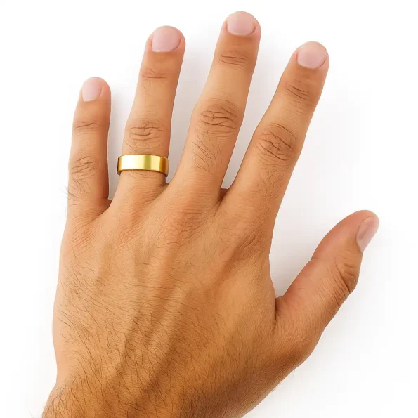 Wide brushed gold band for men – hand top view on white background