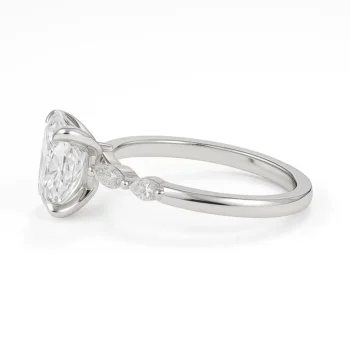 Side view of oval cut lab-grown diamond ring with sleek white gold band and marquise accents