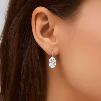 3 carat oval lab-grown diamond drop earrings in white gold shown on model's ear – elegant bridal and occasion jewelry
