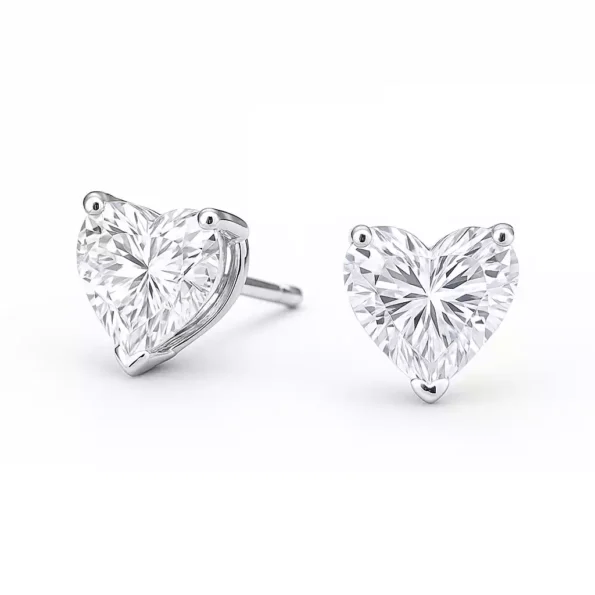 Close-up of heart-cut CVD lab-grown diamond earrings in white gold with three-prong setting