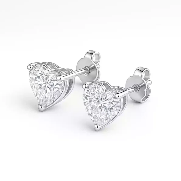 Pair of heart-cut diamond stud earrings with butterfly push backs in white gold setting