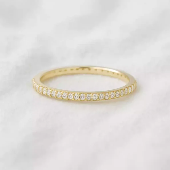 Classic thin yellow gold band with full eternity round lab-grown diamonds – minimalist style.