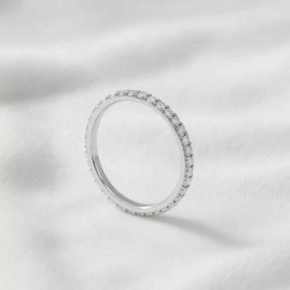 Stackable white gold round cut diamond eternity ring – lab-grown minimalist wedding band.