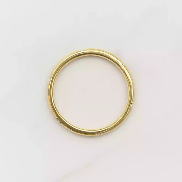 Brushed white gold diamond band ring featuring a horizontal row of round lab-grown diamonds in modern flat design