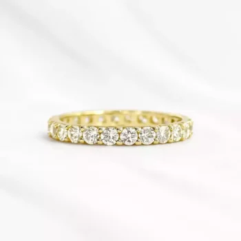 Yellow gold lab-grown diamond eternity band with round cut diamonds