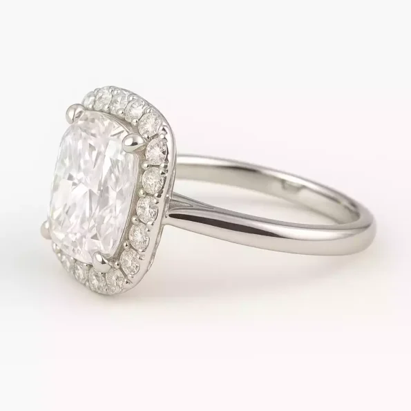 Side profile of cushion cut lab-grown diamond halo ring in white gold with petite band