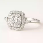 Cushion cut lab-grown diamond halo engagement ring in white gold – front view with round side accents