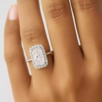 Elongated cushion cut halo diamond engagement ring on woman's hand – lab-grown diamond in white gold