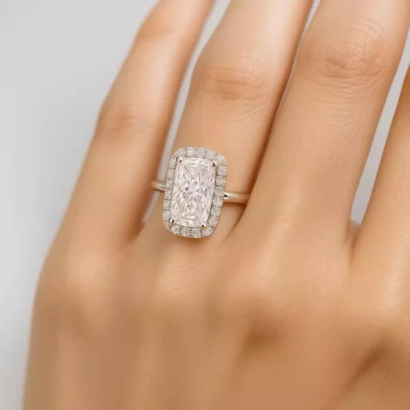 Elongated cushion cut halo diamond engagement ring on woman's hand – lab-grown diamond in white gold