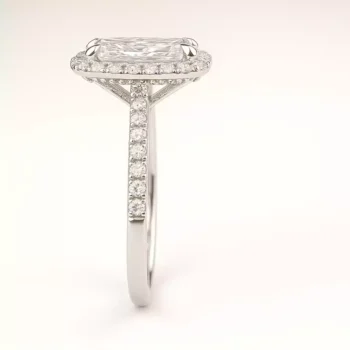 Side profile of elongated cushion halo lab diamond engagement ring with pave band in white gold