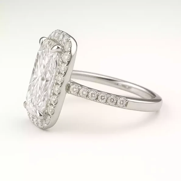 Angled side view of cushion cut halo lab grown diamond ring featuring petite pave band in white gold
