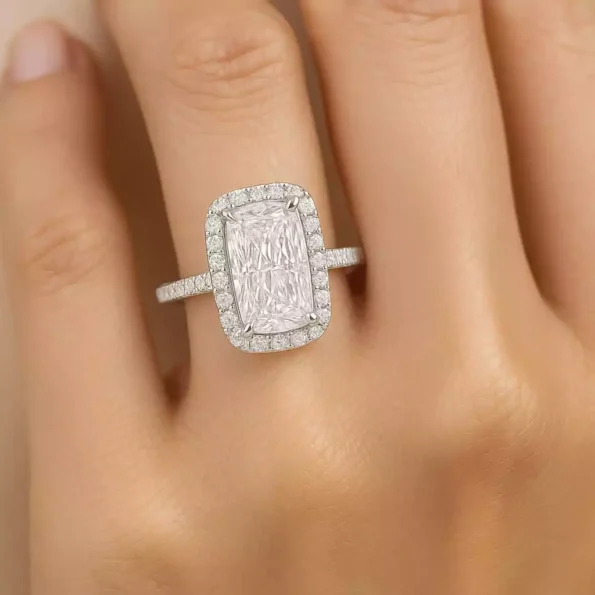 Elongated cushion cut halo diamond engagement ring on hand – lab grown diamond in white gold setting