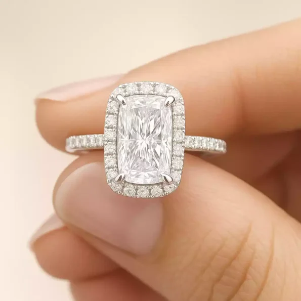Elongated cushion cut halo diamond engagement ring on hand – lab grown diamond in white gold setting