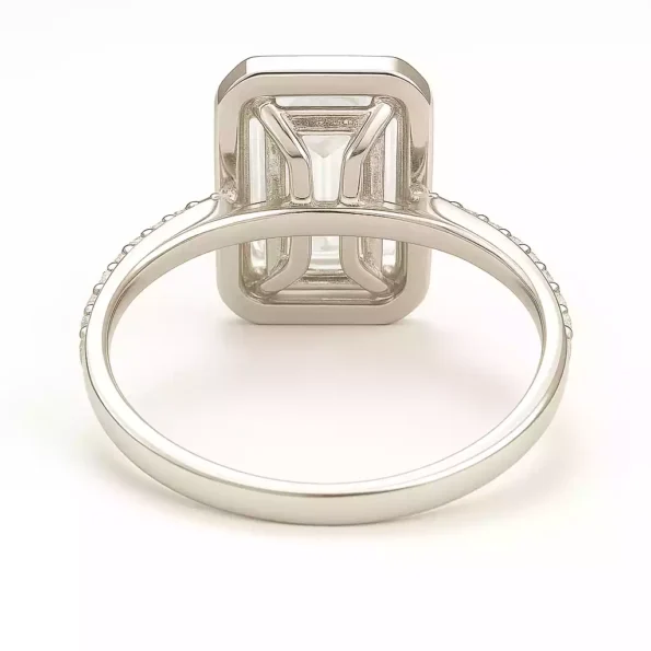 Rear view of emerald cut halo diamond ring with hidden basket setting in white gold