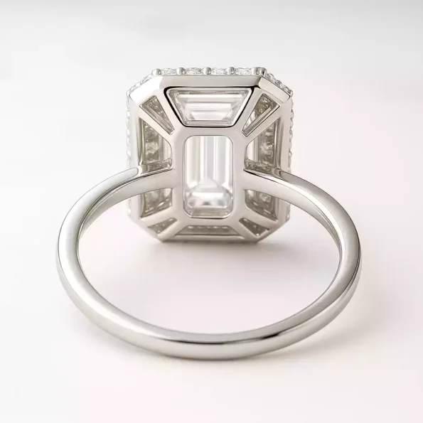 Back view of emerald cut lab-grown diamond halo ring with open gallery and pavé basket in white gold