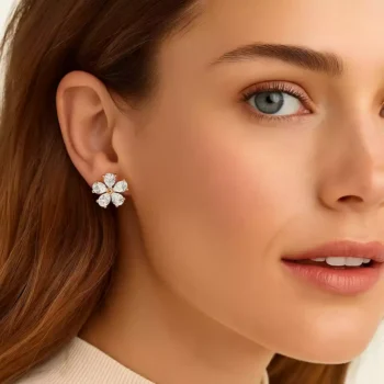 Model wearing floral pear-cut diamond earrings in rose gold – luxury fine jewelry look