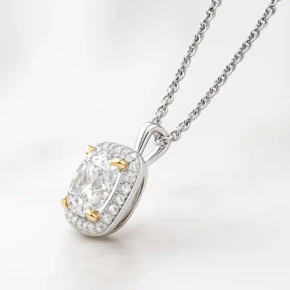 Side profile of cushion cut halo pendant featuring lab-grown diamond with yellow gold prongs in white gold setting