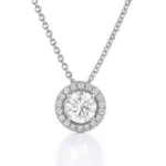 Round halo lab-grown diamond pendant necklace in white gold on plain background – close-up product view
