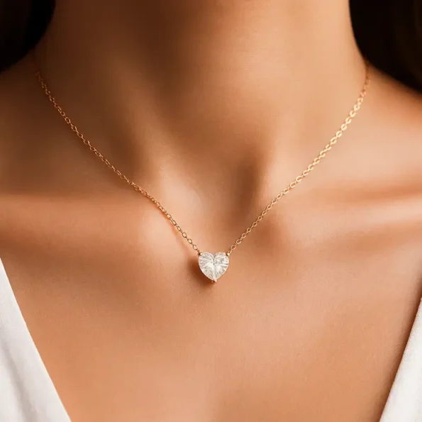 Elegant rose gold heart diamond pendant necklace on woman’s neck – dainty and romantic jewelry