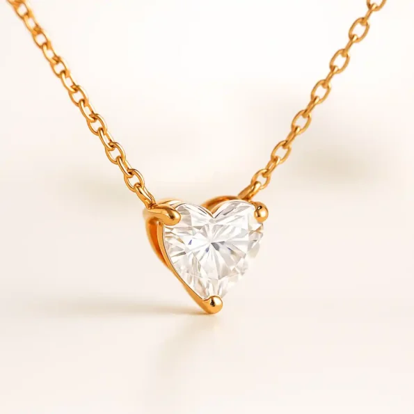Side angle of heart-shaped solitaire diamond pendant in rose gold setting – fine jewelry close-up