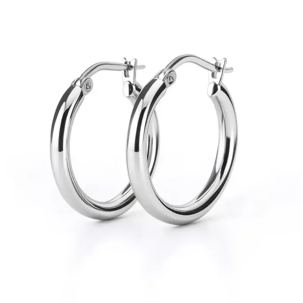 Pair of shiny round hoop earrings in sterling silver with latch-back closure on white background