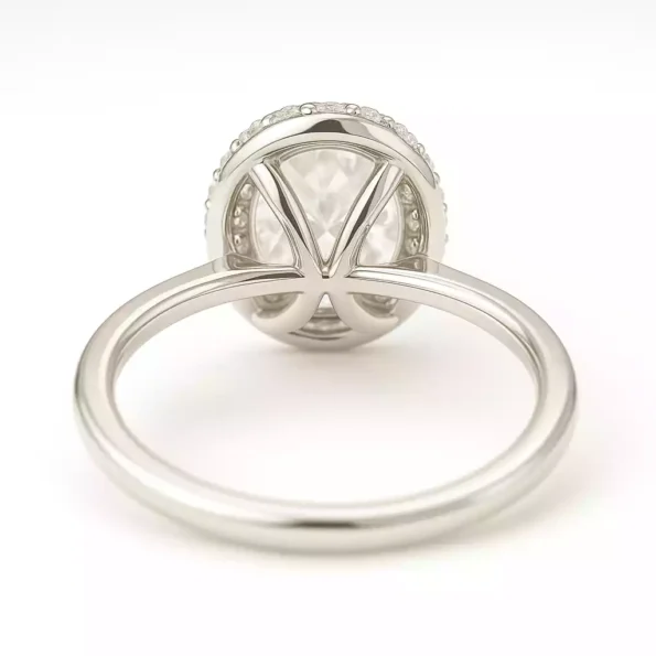 Elegant under-gallery view of oval halo diamond ring with slim 18K white gold band