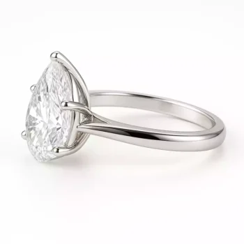 Side profile of pear cut lab diamond ring in sleek white gold band – solitaire setting