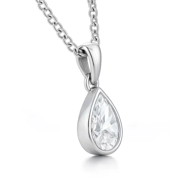 Side profile of pear-cut solitaire diamond pendant in bezel setting with white gold chain