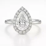 Pear cut halo lab diamond engagement ring in 18K white gold with pavé band – front angle view