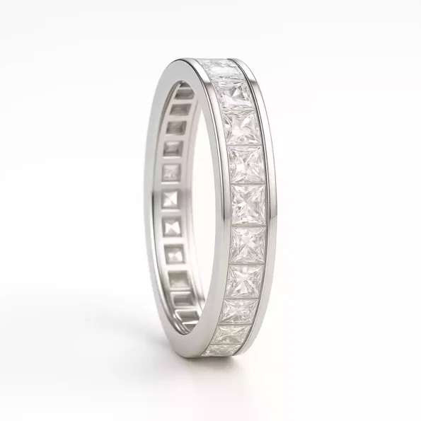 Side profile of princess cut diamond eternity band ring in white gold – channel setting close-up