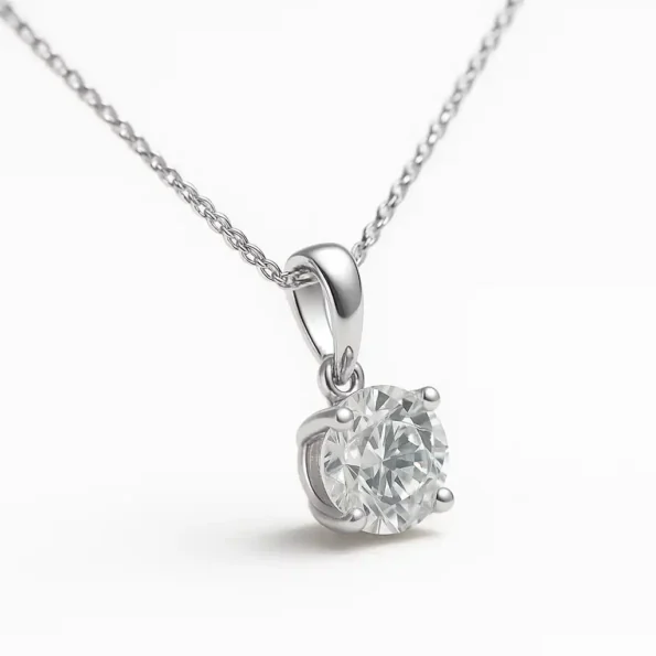 Side view of round cut solitaire lab diamond necklace with four-prong setting in white gold