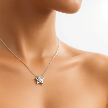 Minimalist star diamond pendant necklace in white gold shown on model for elegant neckline styling