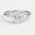 Oval cut lab diamond engagement ring with tapered baguette side stones in white gold – front view