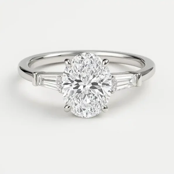Oval cut lab diamond engagement ring with tapered baguette side stones in white gold – front view