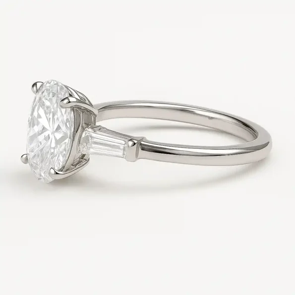Side view of oval cut lab grown diamond ring with tapered baguette diamonds in white gold setting