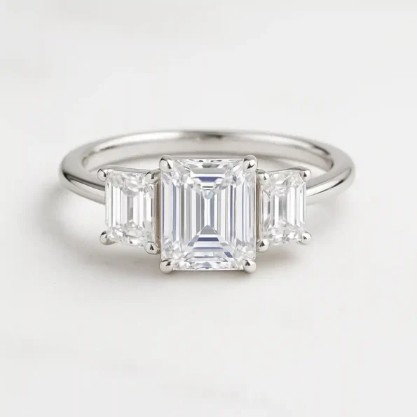 Emerald cut three-stone lab-grown diamond engagement ring in white gold with step-cut side stones