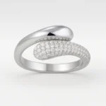 Bypass style white gold diamond ring with micro pavé setting and polished finish