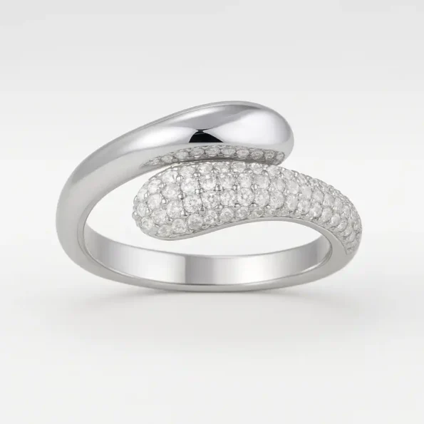 Bypass style white gold diamond ring with micro pavé setting and polished finish