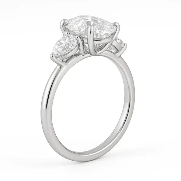 Back view of oval cut lab diamond ring with pear side stones and prong setting in white gold