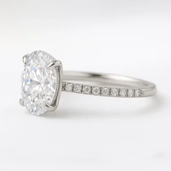 Side profile of oval lab grown diamond ring with pavé band in white gold setting