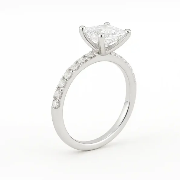Angled side view of princess cut solitaire lab-grown diamond engagement ring with diamond accents on shank