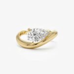 1.50ct Pear Cut Solitaire Engagement Ring - Sculptural Bypass Yellow Gold